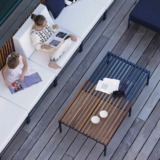 Table basse SUTRA EGO Paris Table basse SUTRA de Ego Paris Design Studio Français 5.5 une rallonge intégrée ajustable par glissement en teck et en aluminium thermolaquées.